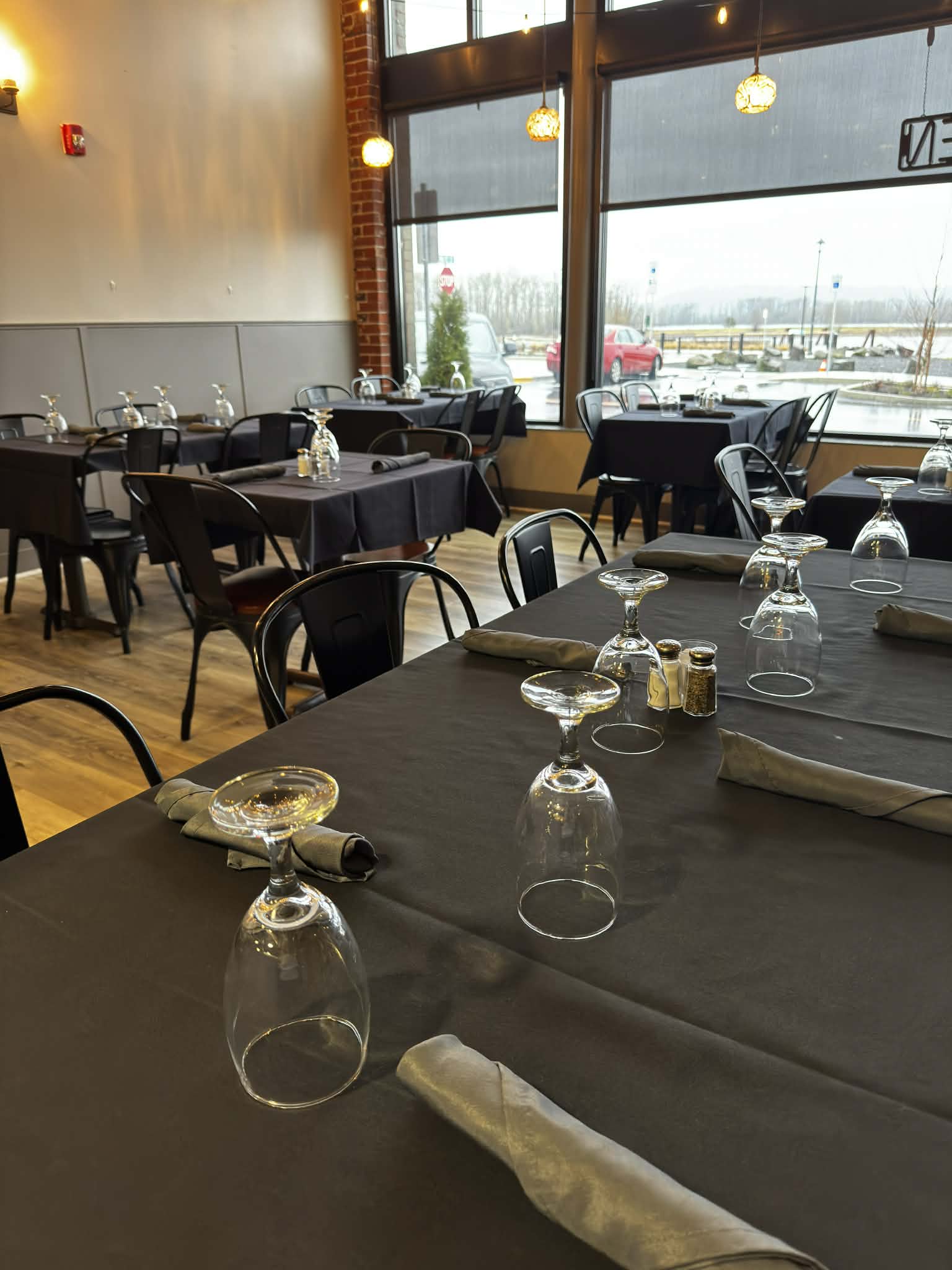 Candlelit table setting with exposed brick
